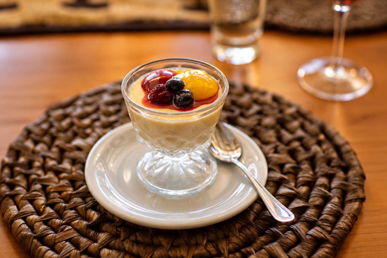 A cream dessert with berries