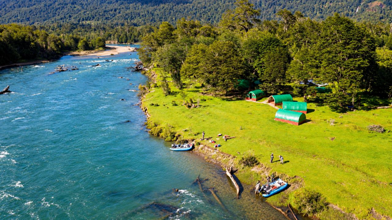 Aerial view of the basecamp tents beside the Rio Blanco
