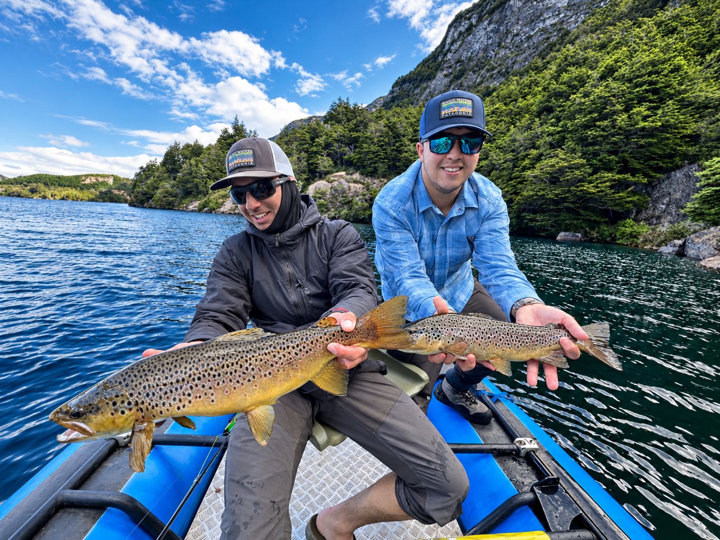 Two anglers with a wild brown trout on the raft
